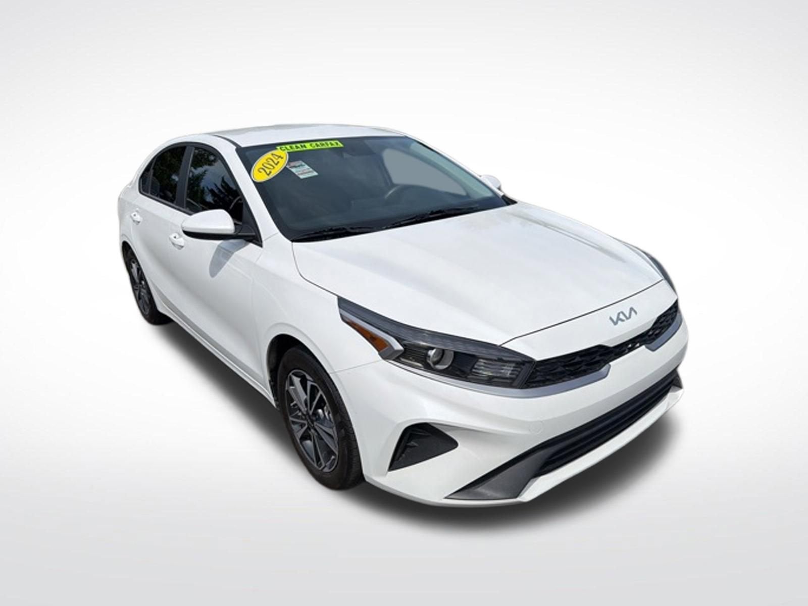 2024 Kia Forte LXS in White — front three-quarter view