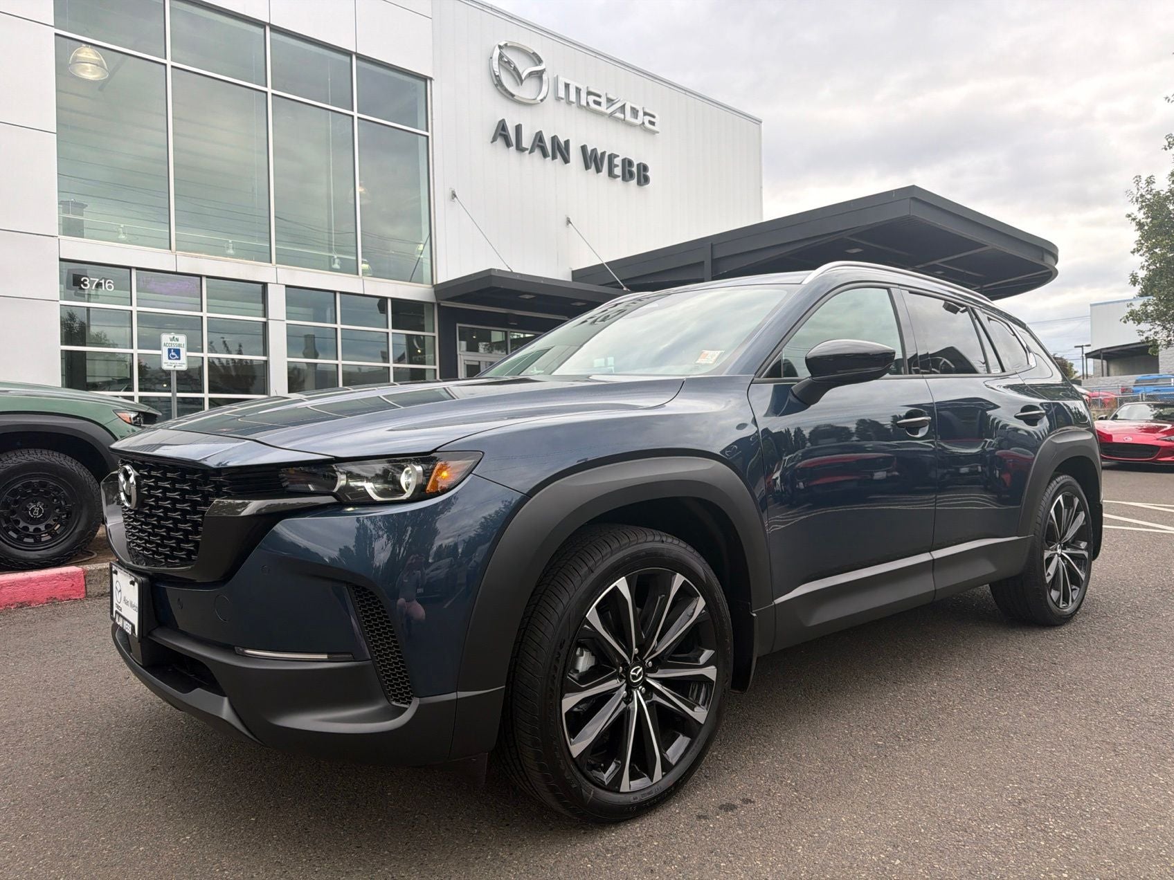 2026 Mazda Mazda CX-50 2.5 S Premium AWD in Ingot Blue Metallic — front three-quarter view