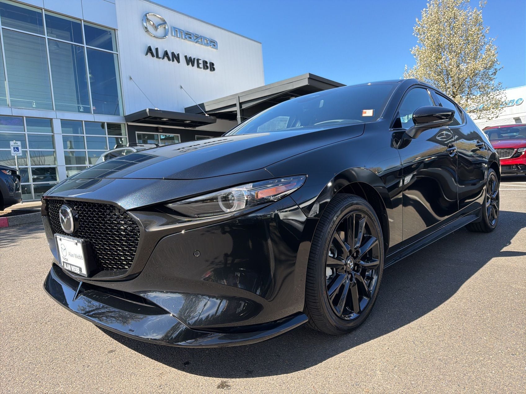 2026 Mazda Mazda3 Hatchback 2.5 Turbo Premium Plus AWD in Jet Black Mica — front three-quarter view